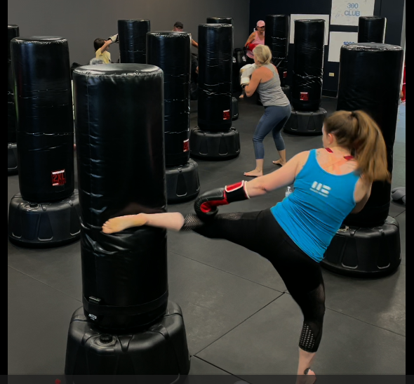 Cardio kickboxing class working the bags at Thrive in Northwest Las Vegas